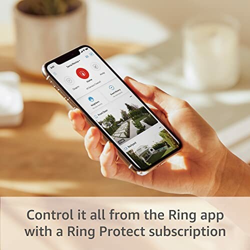 Hand holding smartphone with Ring app open, promoting Ring Protect subscription.